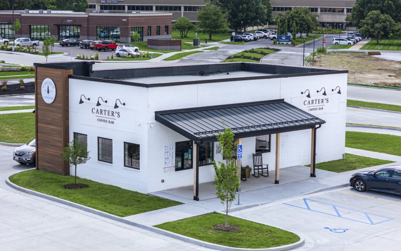 a restaurant with a parking lot