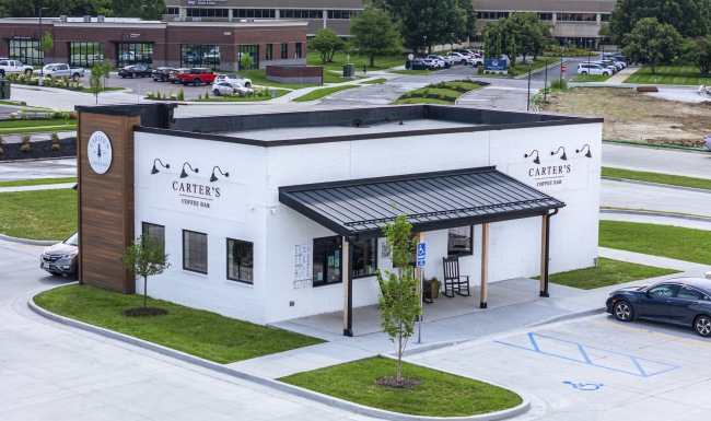 a restaurant with a parking lot
