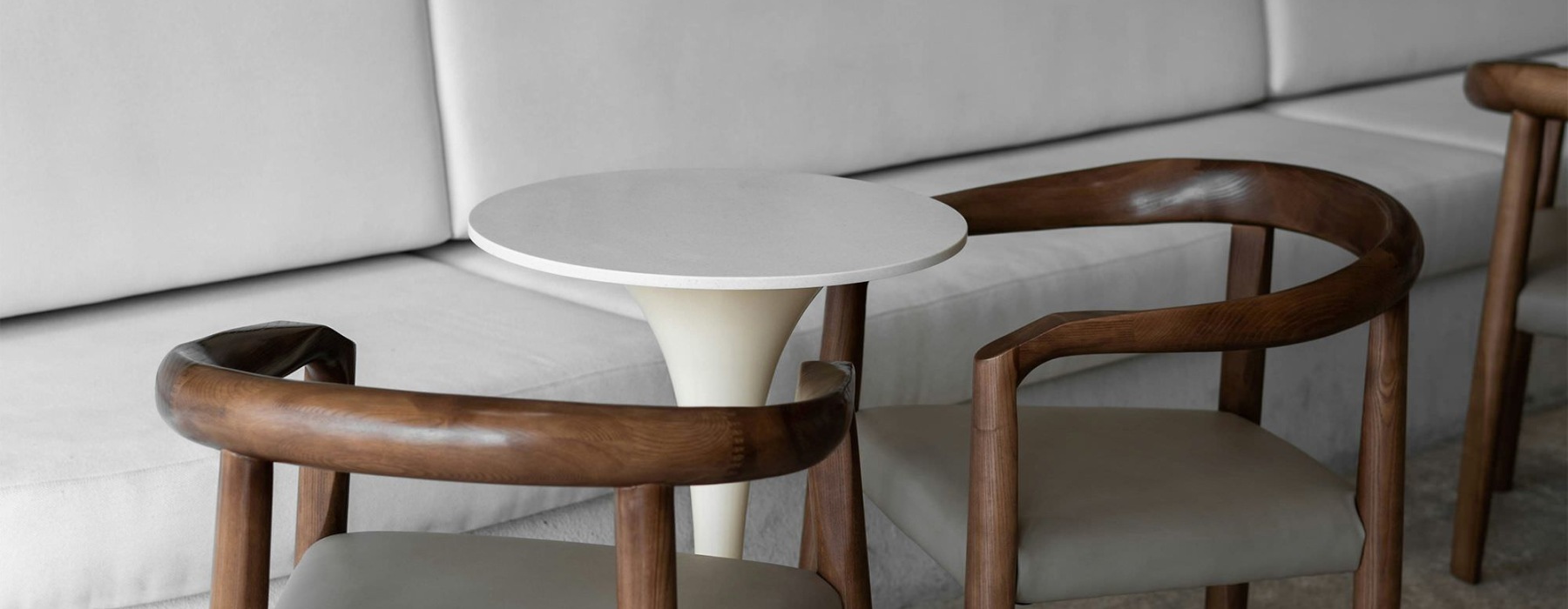 a couch with chairs and a table