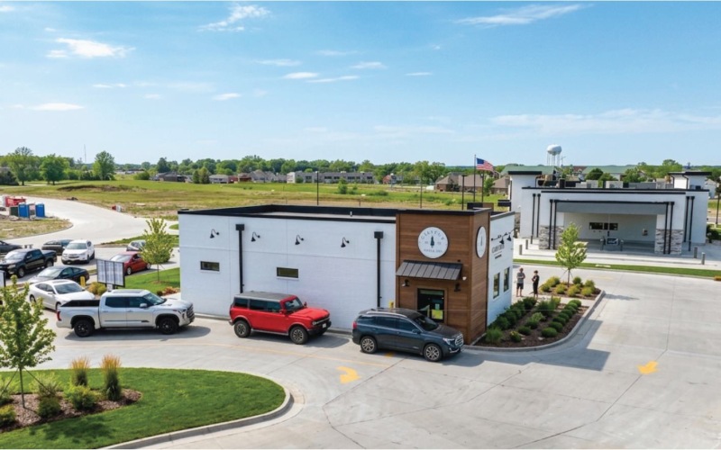 an aerial view of a restaurant with cars